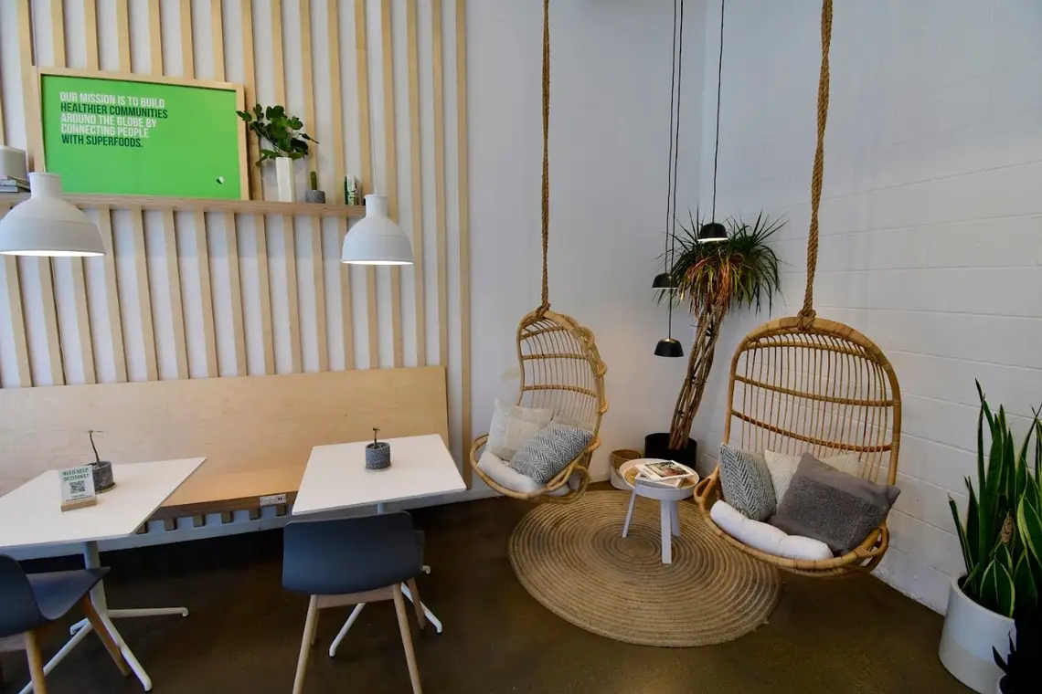 Hanging chairs and tables in the seating area at Pure Green Lincoln Park