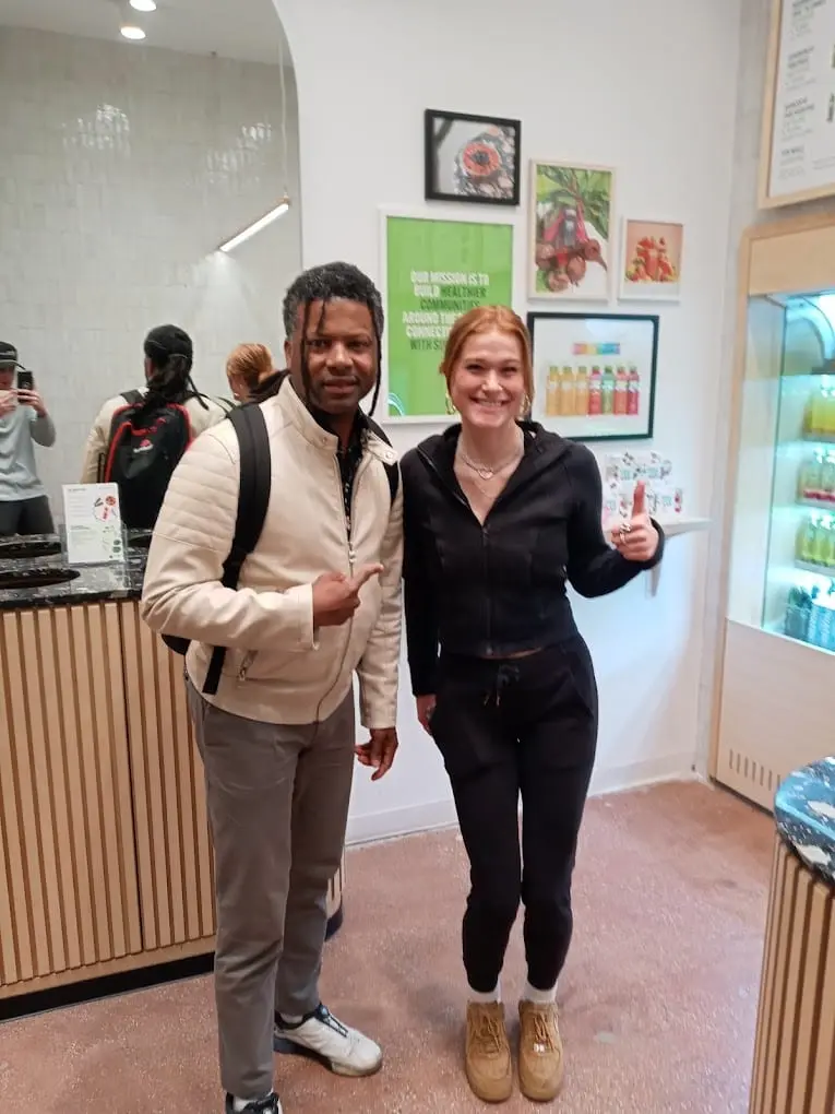 Guests with Pure Green smoothies inside the Gold Coast store