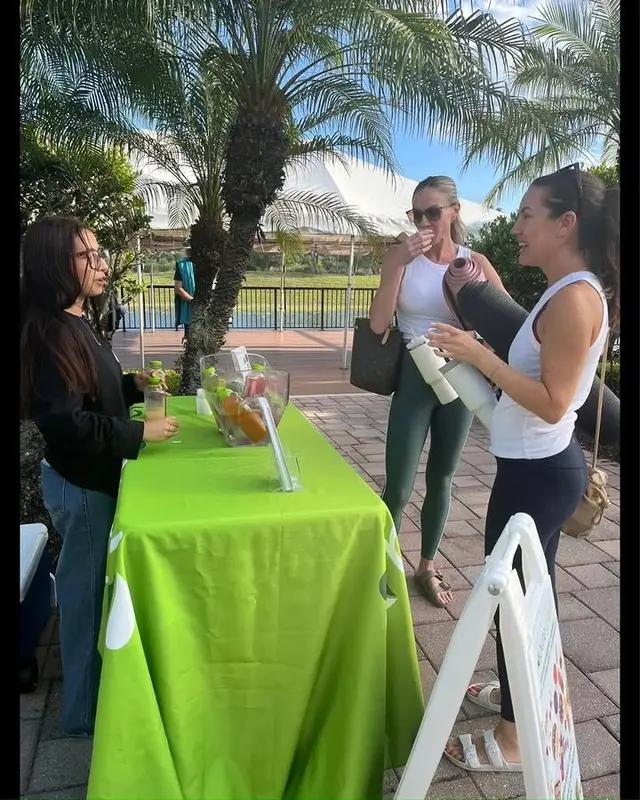 Guests enjoying drinks at a Pure Green Coral Springs pop-up